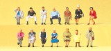 Seated travelers. 14 miniature figures